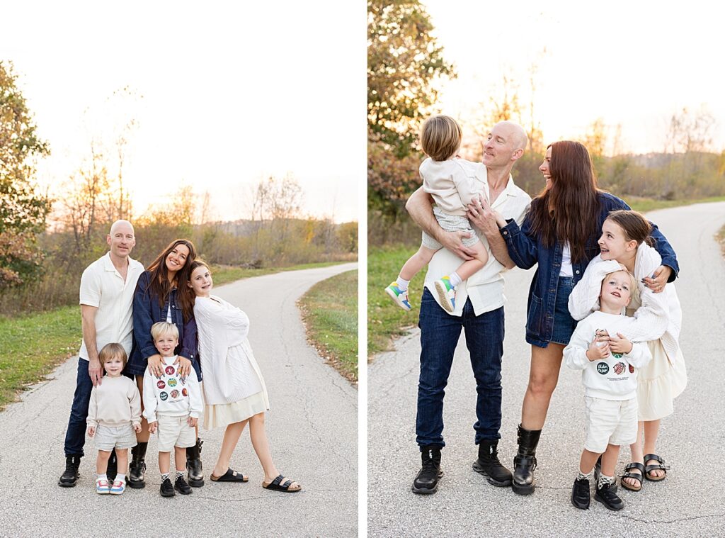 Family of five standing on a winding path at sunset, with soft light and trees in the background.