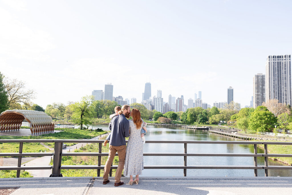 Family session with a Chicago family photographer overlooking the pond at Lincoln Park Nature Boardwalk.